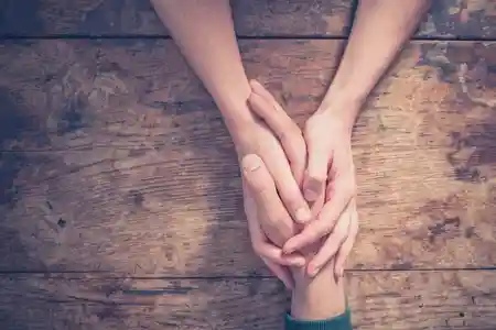 Caring hands together